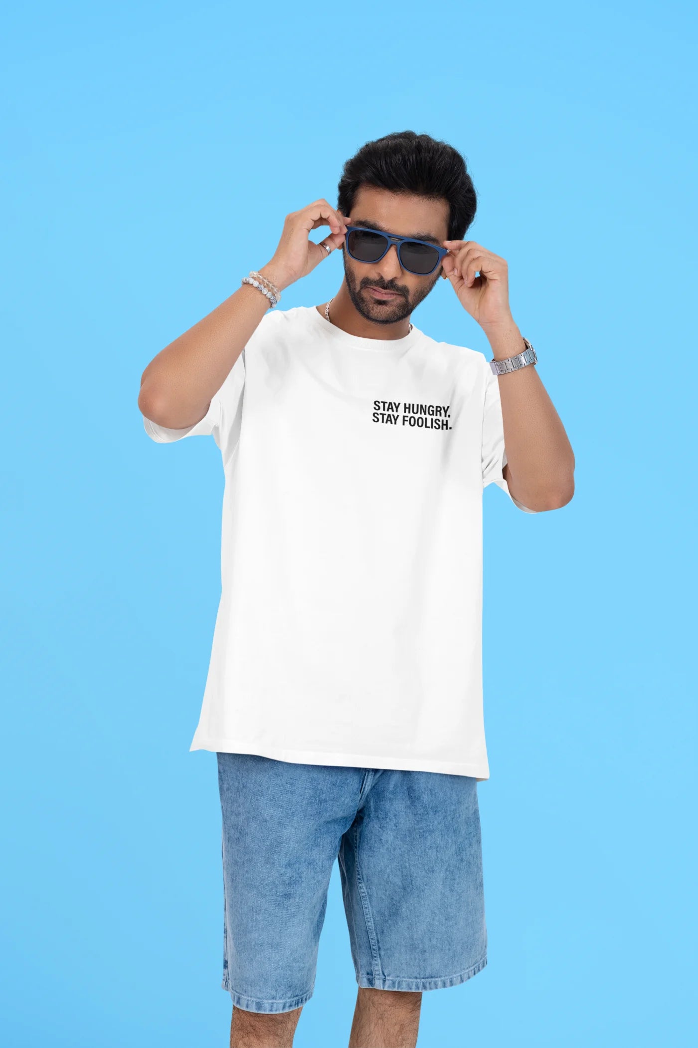 Blijf hongerig, blijf onbezonnen. Oversized T-shirt.